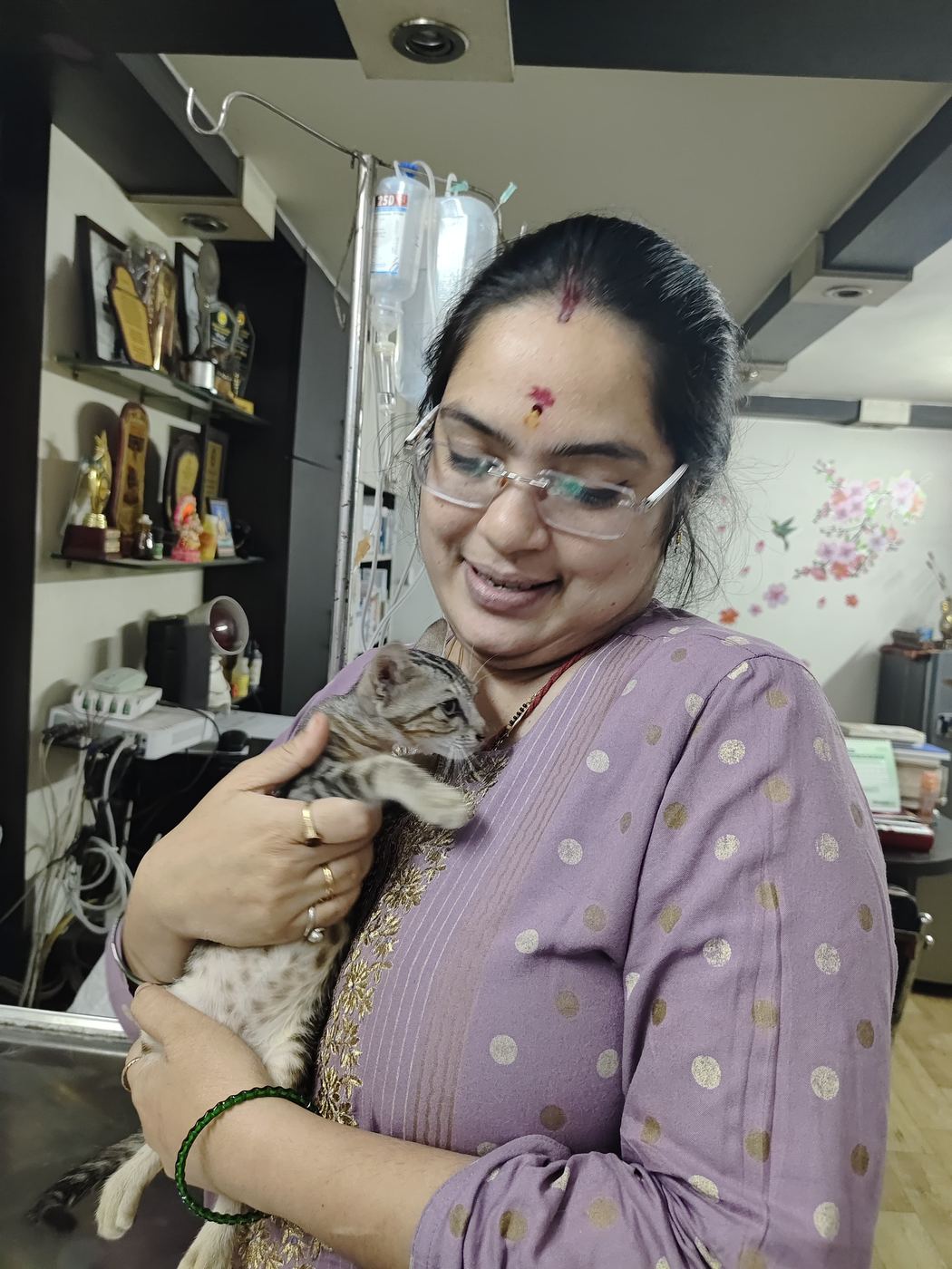 Dr. Pooja Hirulkar holding a kitten patient at the clinic