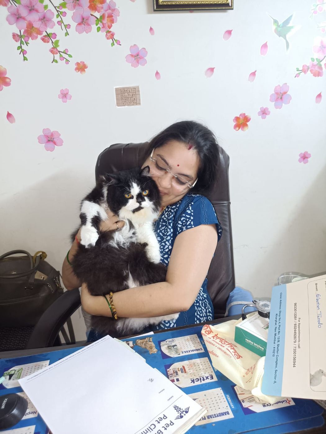 Dr. Pooja Hirulkar holding a Persian cat patient